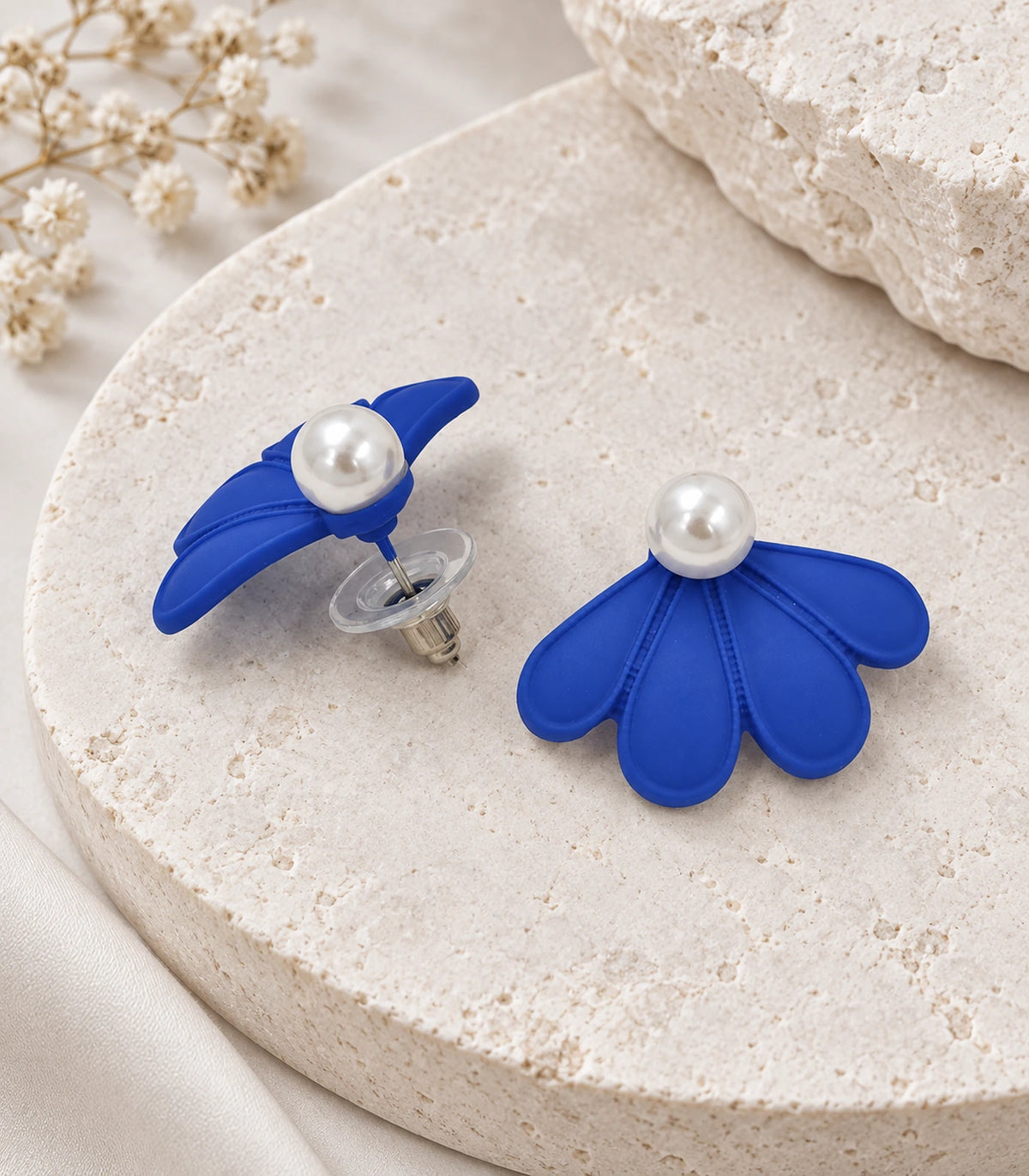 JIMIKI Royal Blue pearl fan petal stud earrings, pair in an editorial flat lay #color_royal blue