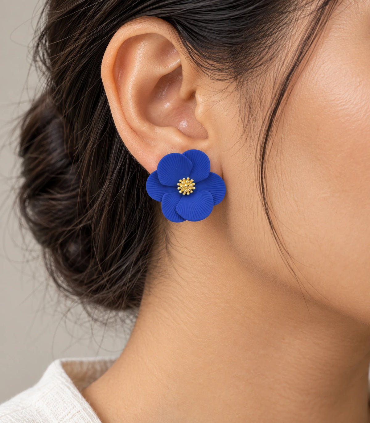 JIMIKI Royal Blue ribbed flower stud earrings, worn view showing the flower stud #color_royal blue