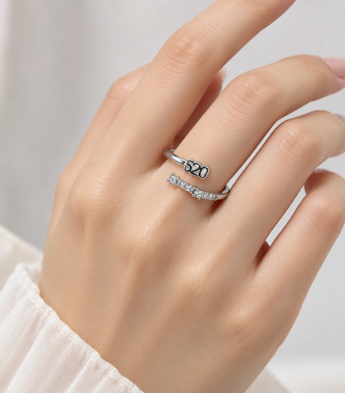 JIMIKI Silver 520 Crystal Bypass Adjustable Ring in Silver - worn styling view #color_silver