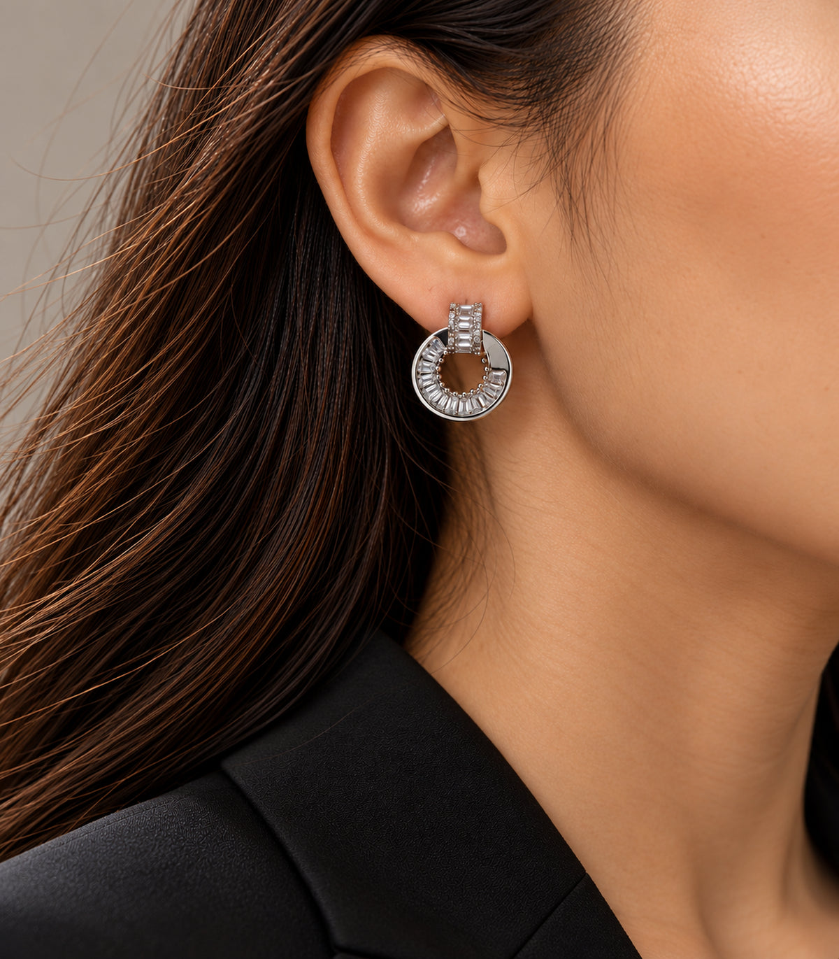 Silver Baguette Halo Circle Earrings worn on one ear with black outfit