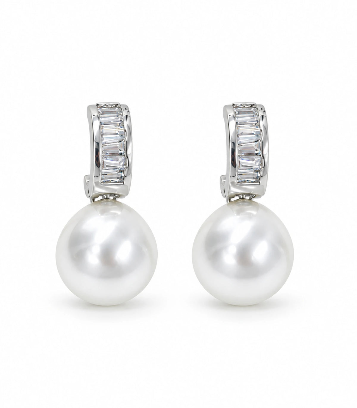 Silver baguette huggie earrings with white pearl-style drops, pair on a white background