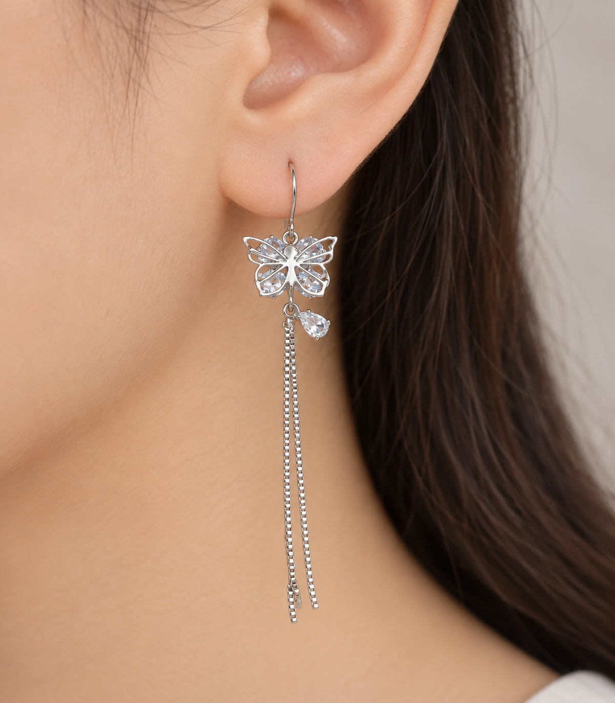 JIMIKI Silver Butterfly Crystal Chain Drop Earrings in Silver Tone, close-up detail