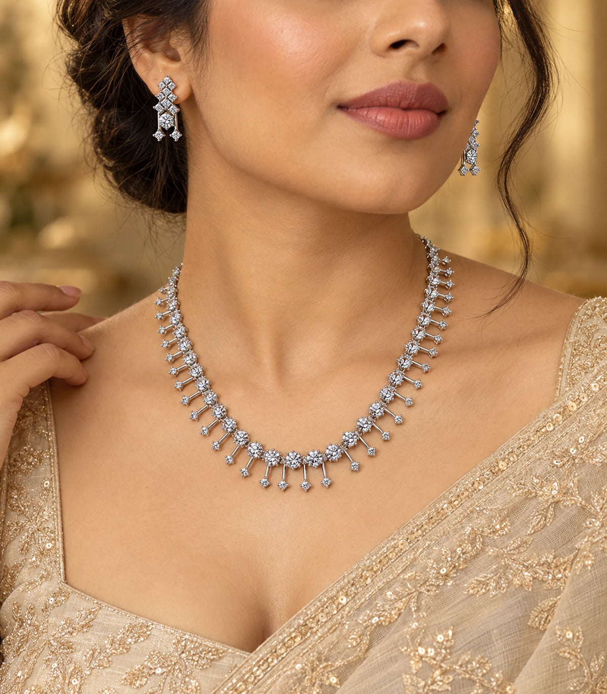 Silver-tone clear necklace set and matching earrings worn with an occasion outfit