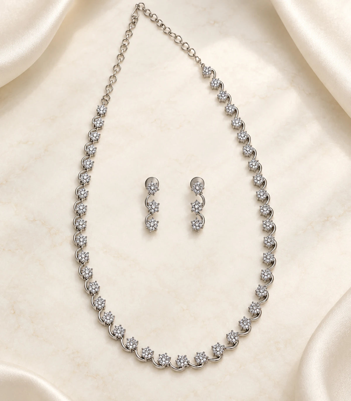 Silver Clear Round Crystal Necklace Set with necklace and matching earrings in a styled flatlay
