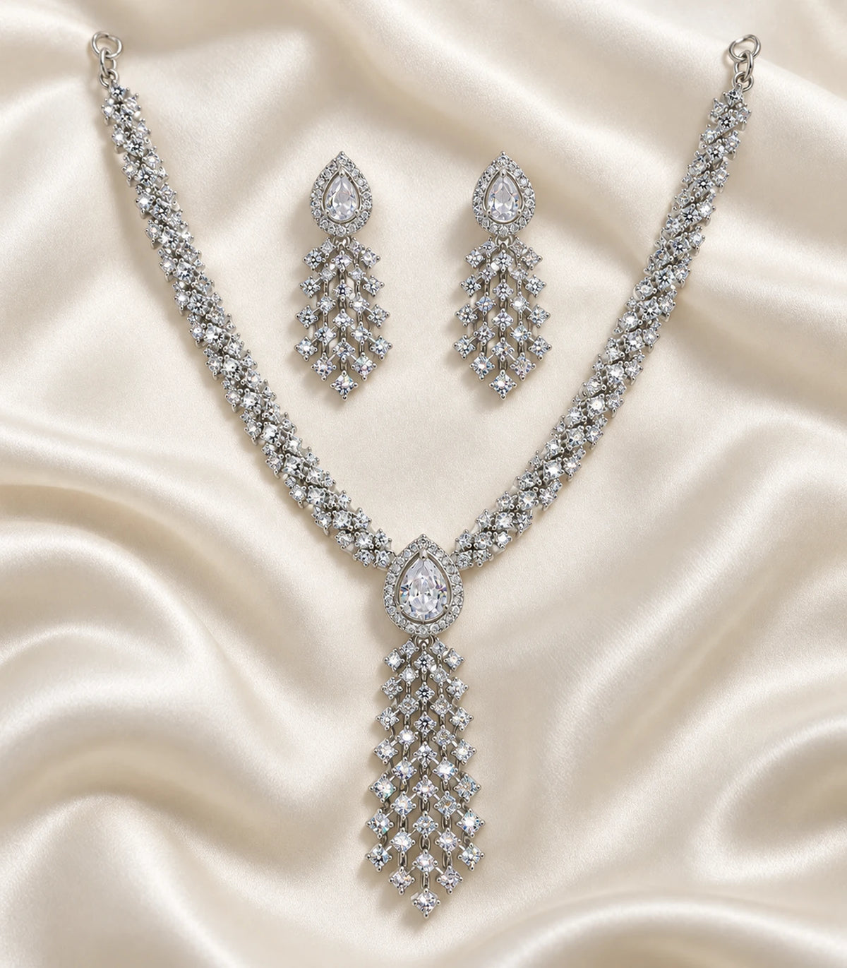 Silver Clear Lattice Drop Crystal Necklace Set with both earrings arranged on satin