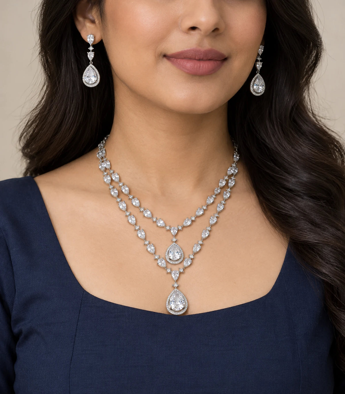 Silver clear layered teardrop necklace set worn with a navy outfit