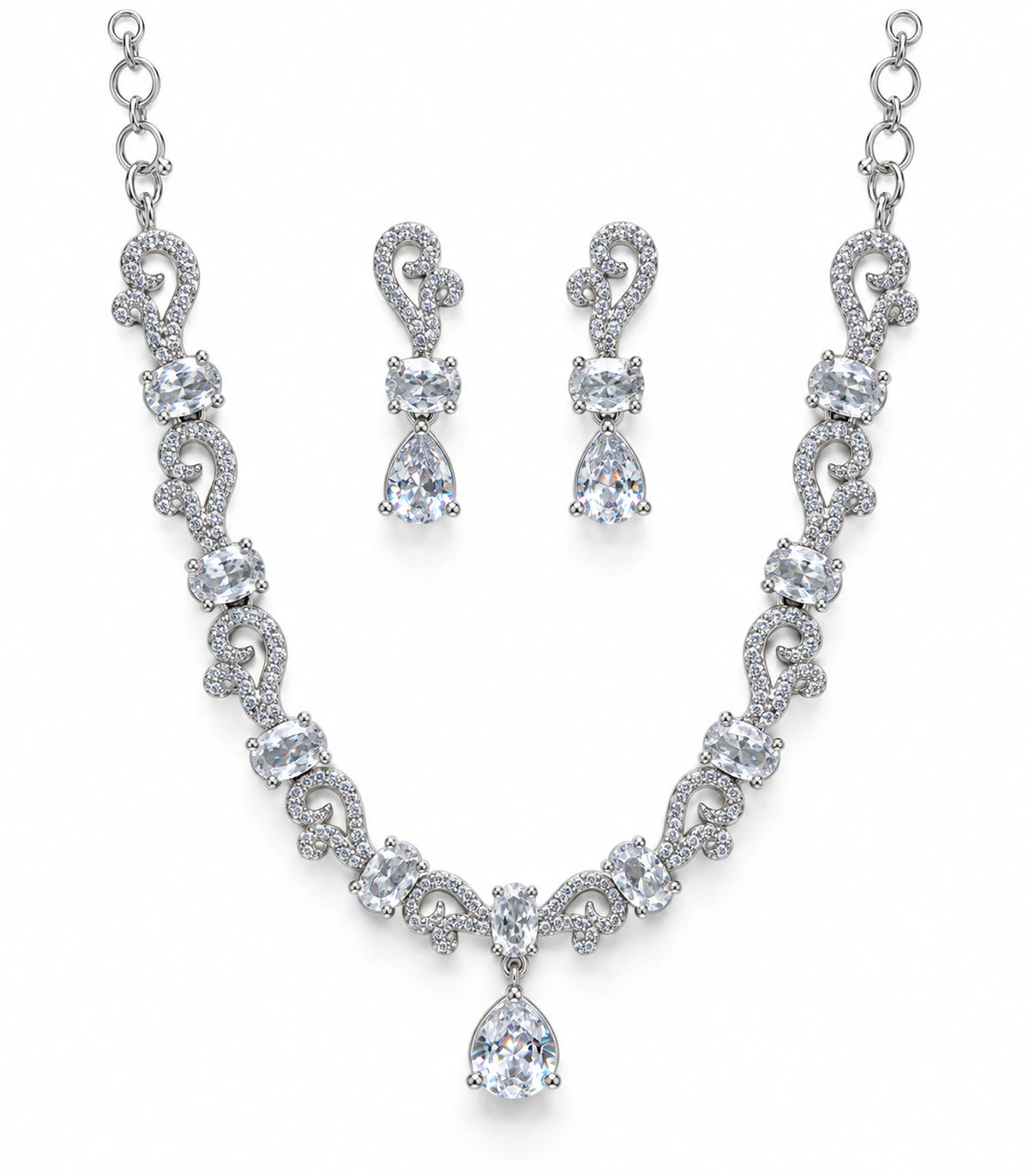 Silver-tone paisley necklace with clear oval stones and a teardrop pendant, displayed with matching drop earrings on white