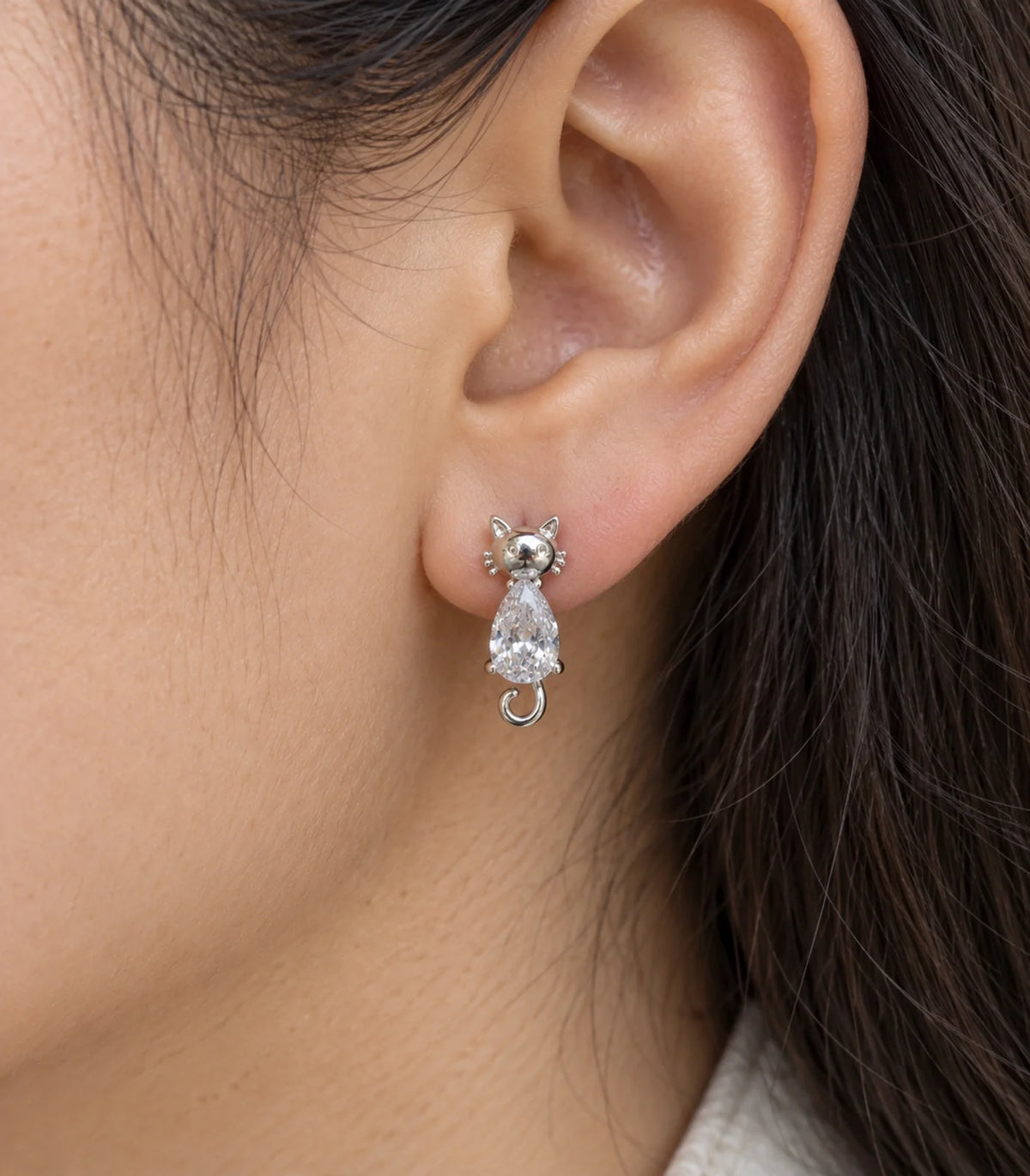 JIMIKI Silver Crystal Cat Drop Earrings - worn close-up showing earring detail #color_silver