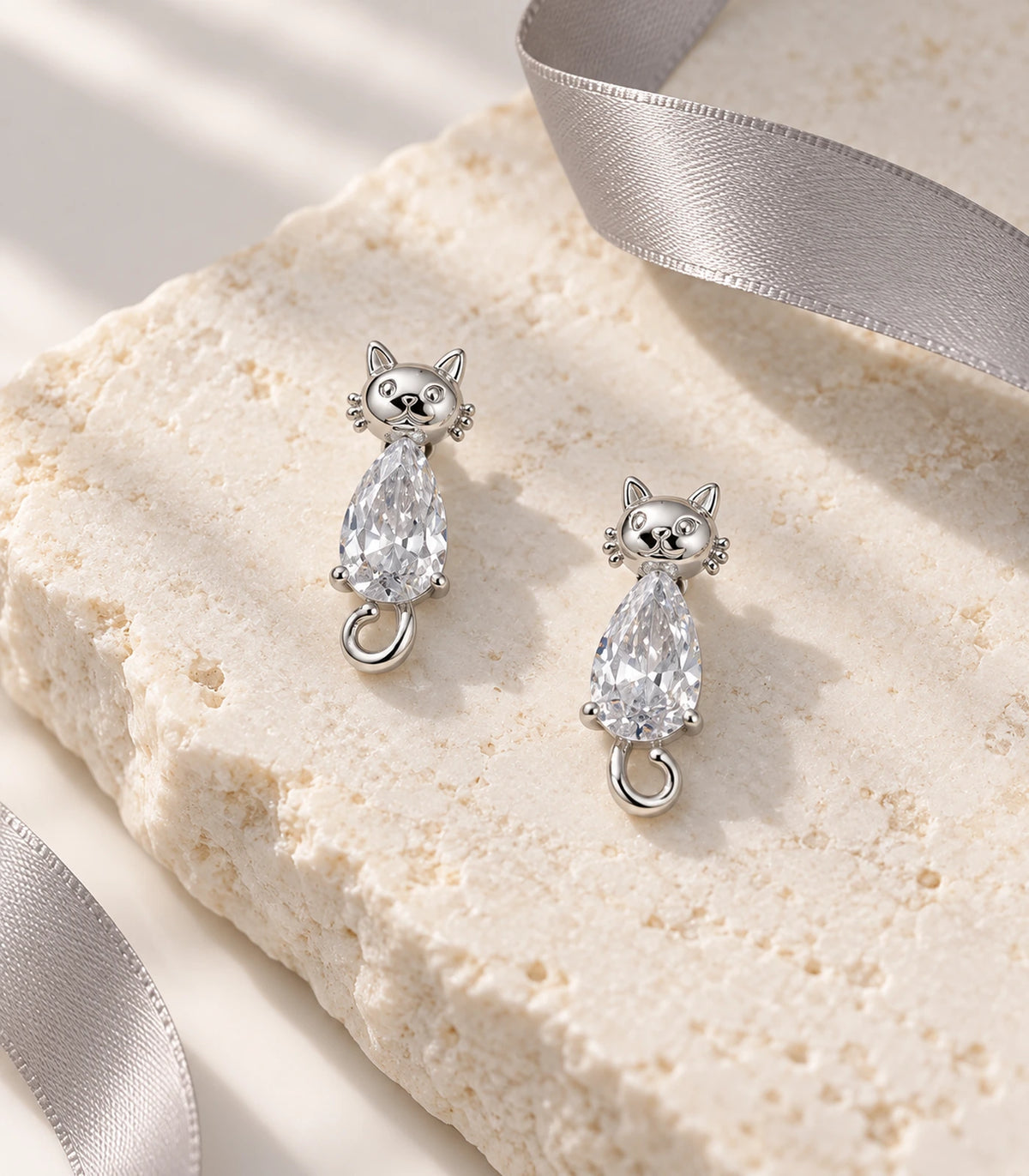 JIMIKI Silver Crystal Cat Drop Earrings - editorial-flatlay #color_silver
