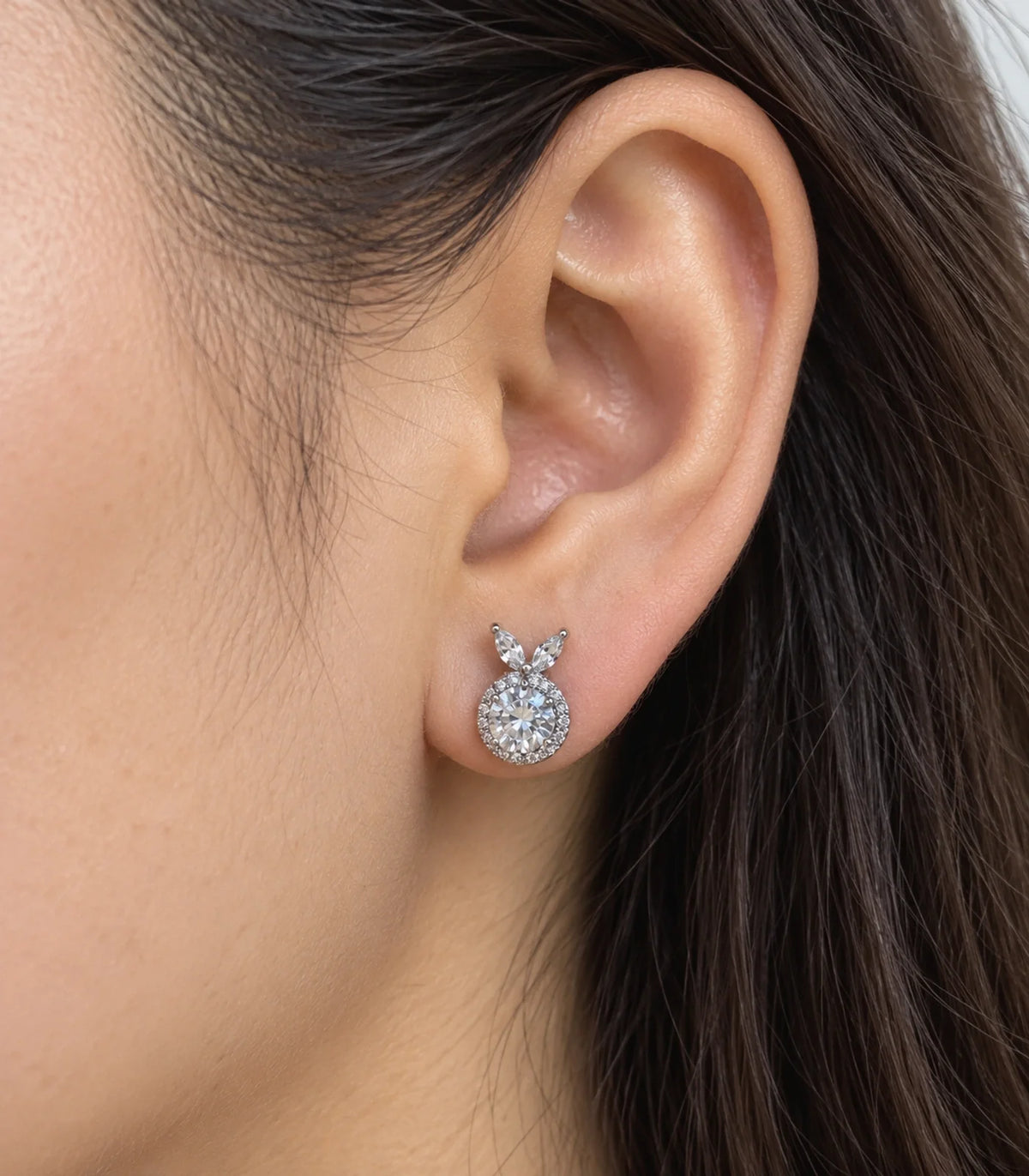 JIMIKI Crystal Halo Leaf Stud Earrings in Silver - worn close-up showing earring detail #color_silver