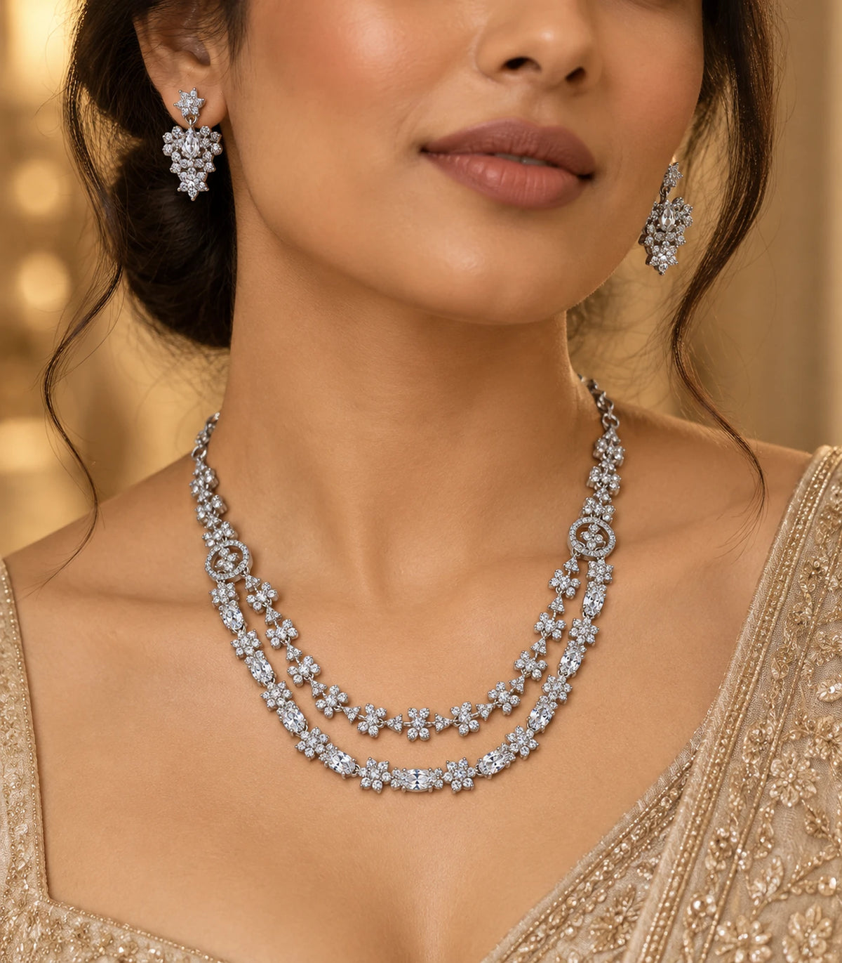 Silver-tone double-layer floral crystal necklace and matching earrings in a three-quarter worn view