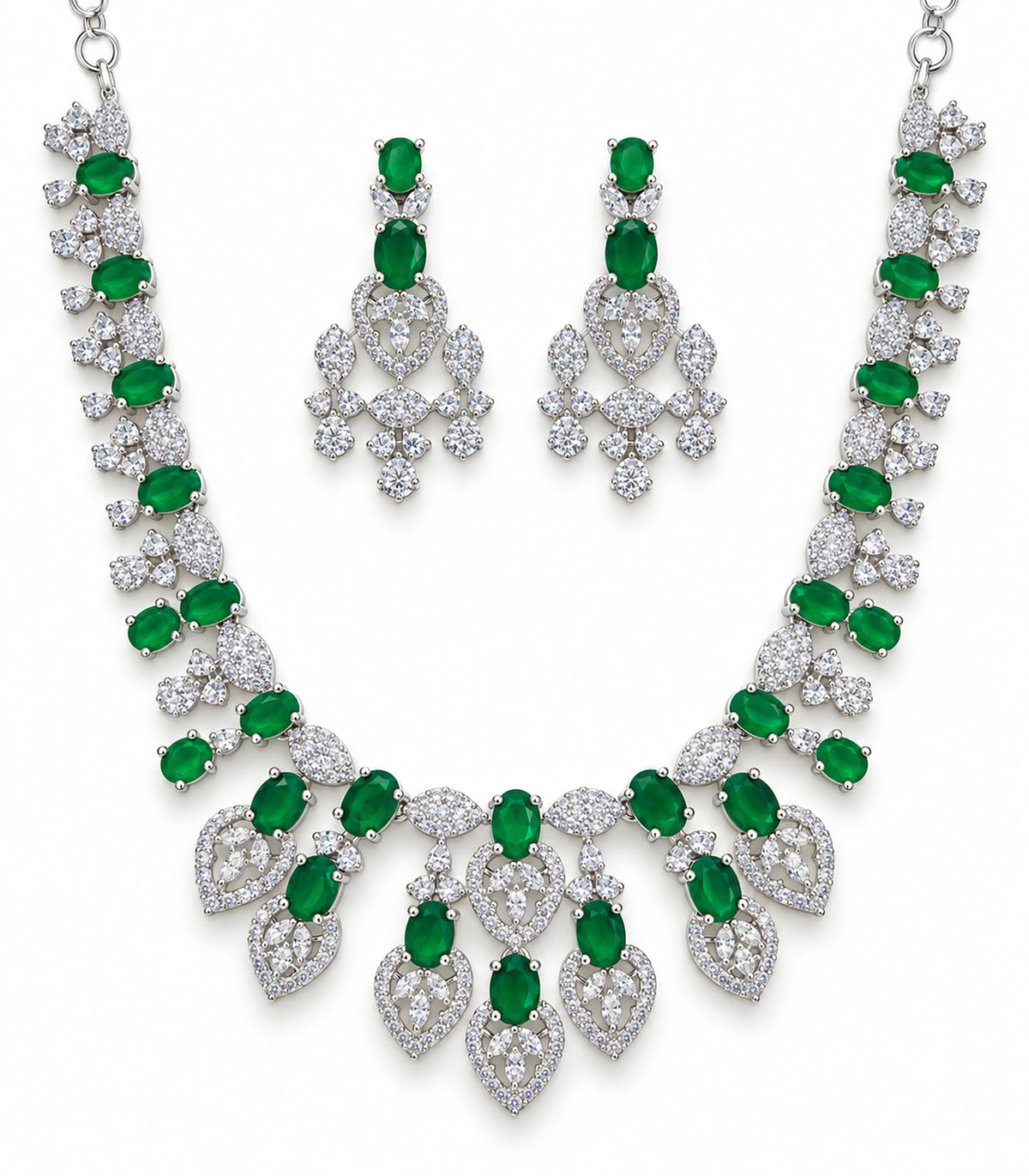 Silver-tone necklace with emerald-green oval accents and matching pair of drop earrings on white