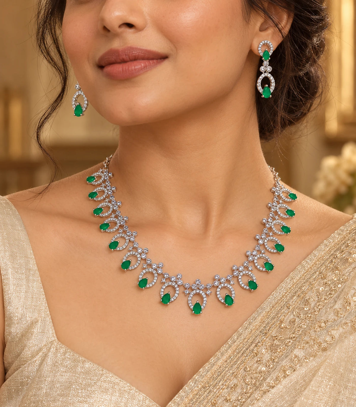 Silver emerald teardrop fringe necklace set worn in an editorial portrait