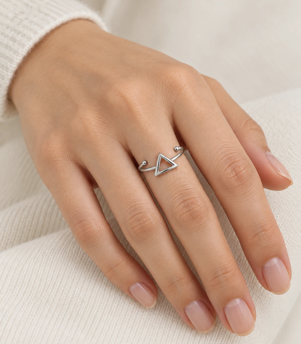 Silver Hollow Triangle Open Ring shown on a hand