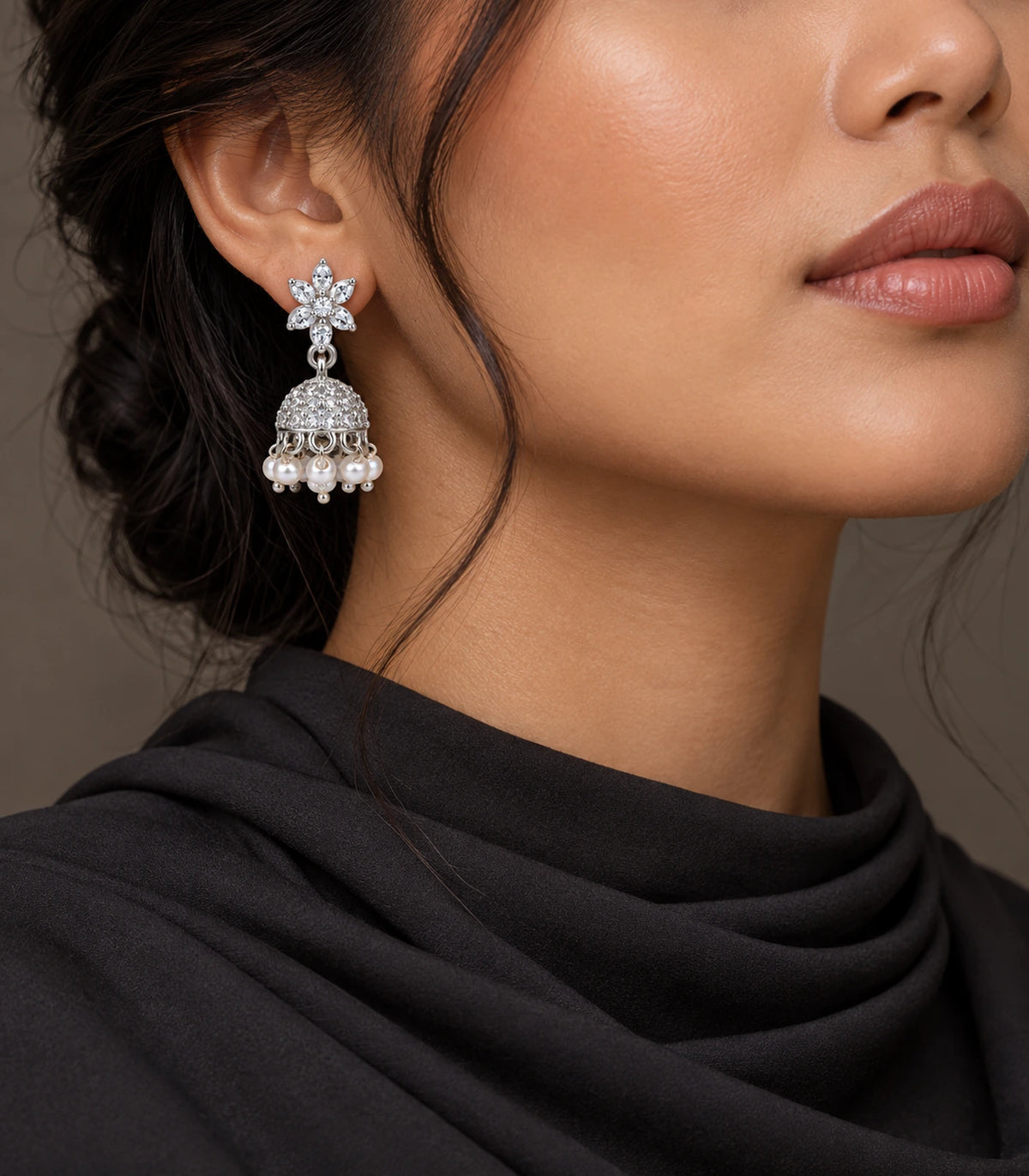 JIMIKI Silver Leaf Flower Crystal Jhumka Earrings - Earring styled with a dark draped outfit #color_silver