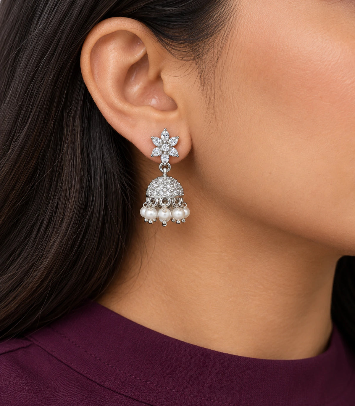 JIMIKI Silver Leaf Flower Crystal Jhumka Earrings - Earring worn with a plum outfit #color_silver