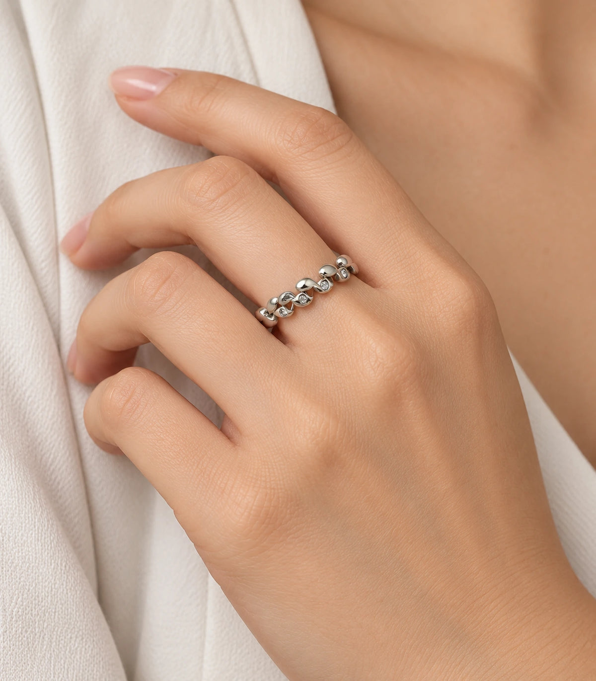 JIMIKI Silver Linked Leaf Crystal Ring in Silver - worn styling view #color_silver