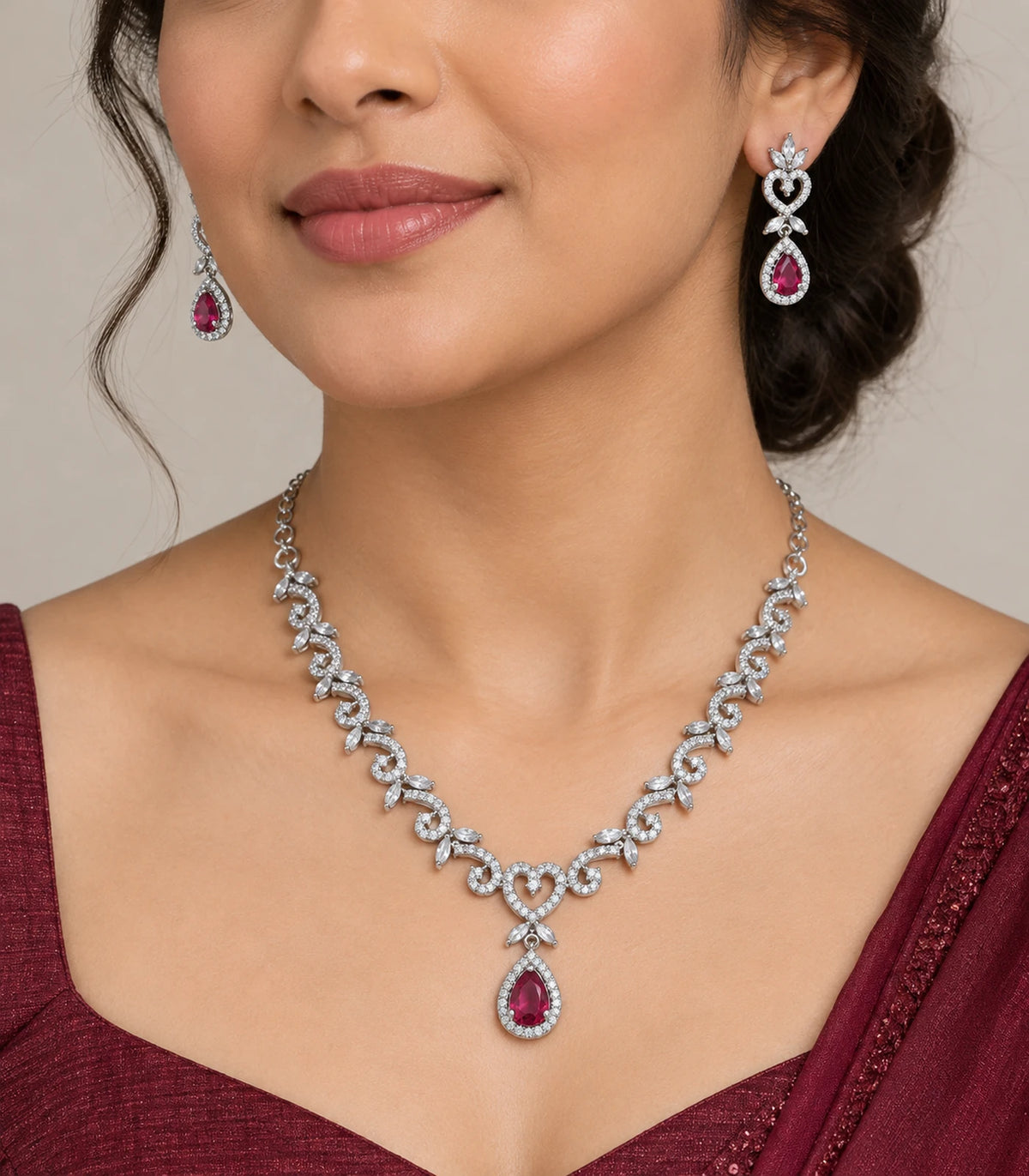 Silver magenta heart teardrop necklace set worn with a burgundy outfit