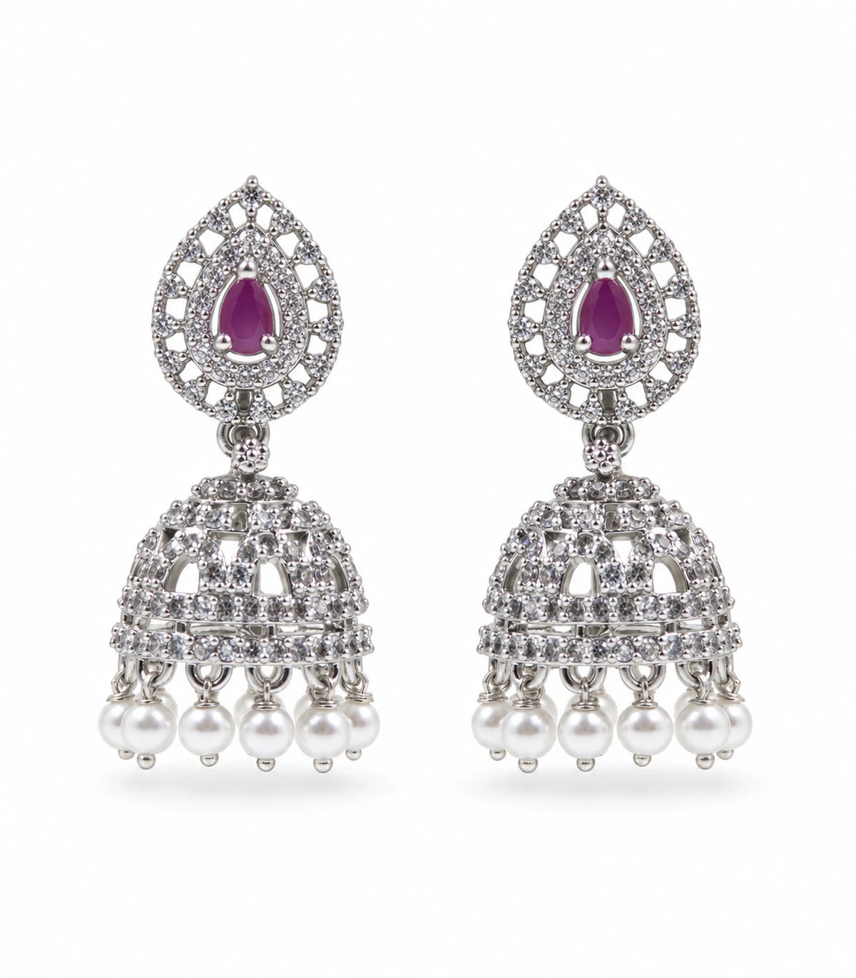 Silver-tone magenta openwork jhumka earring pair with white pearl-look fringe on a white background