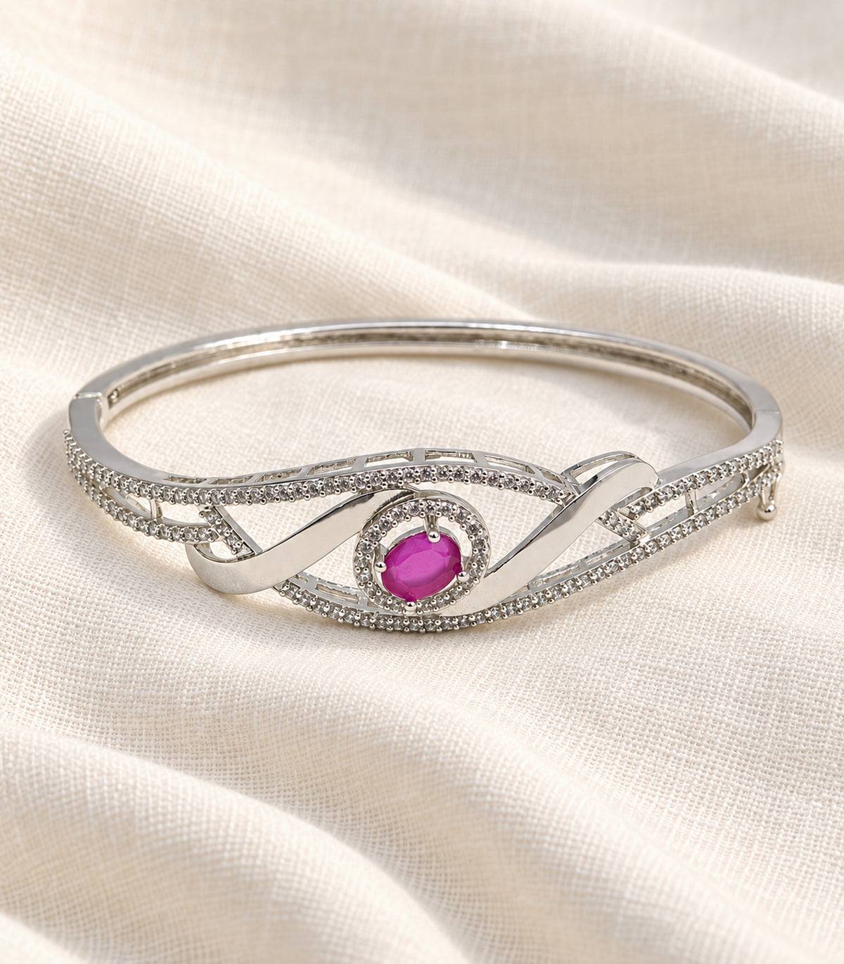 Complete silver magenta oval ribbon bangle on ivory linen