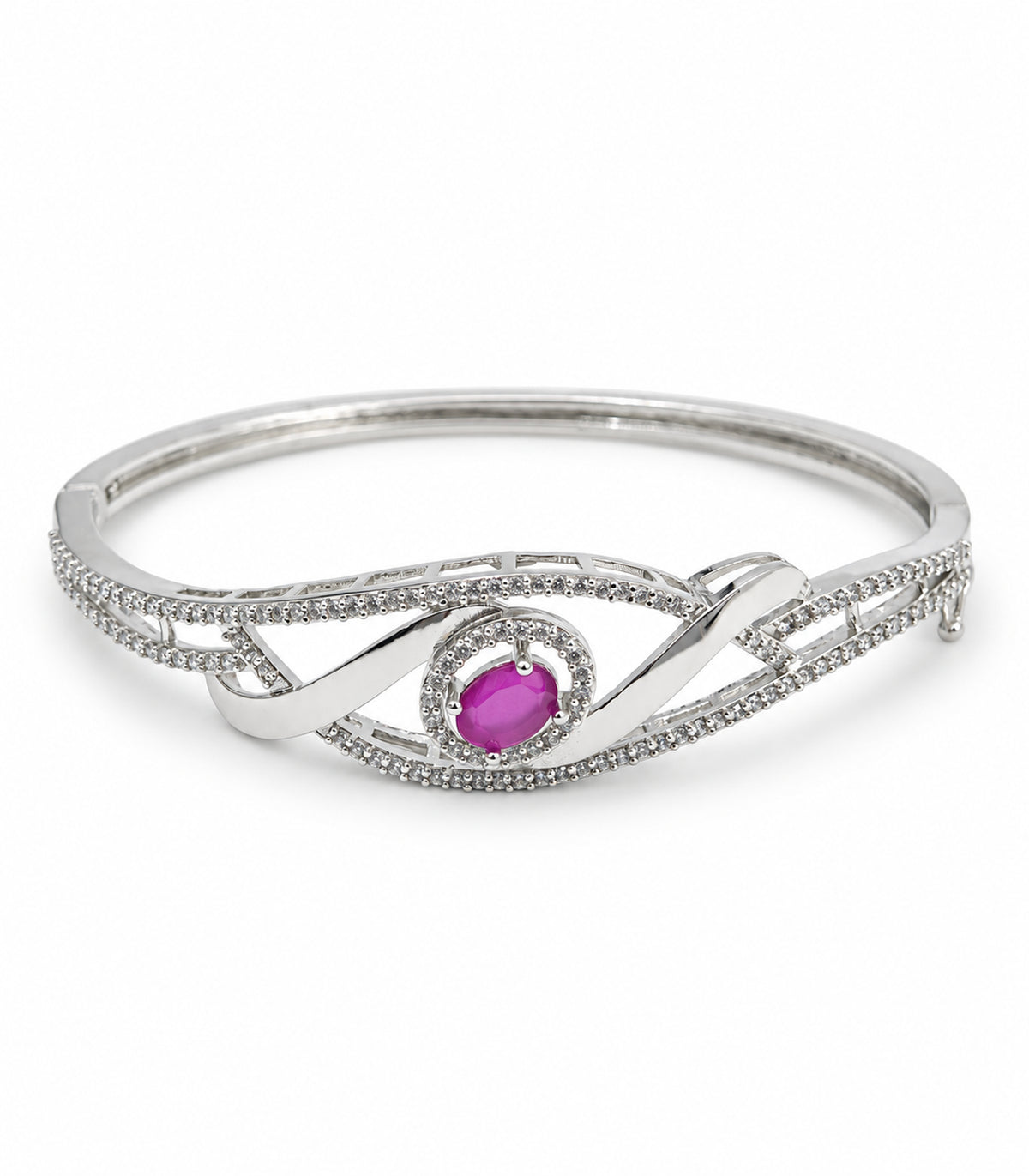 Silver-tone oval ribbon bangle with magenta centre and clear-stone halo on white