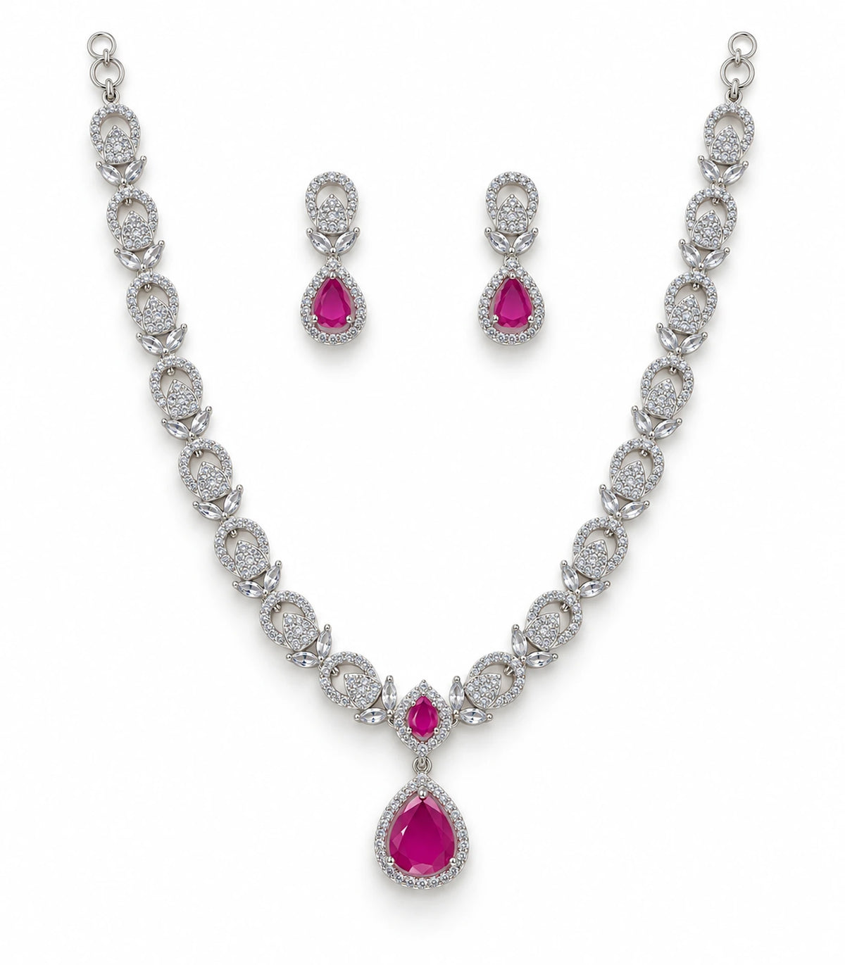 Silver-tone magenta crystal necklace with matching pair of teardrop earrings on white background