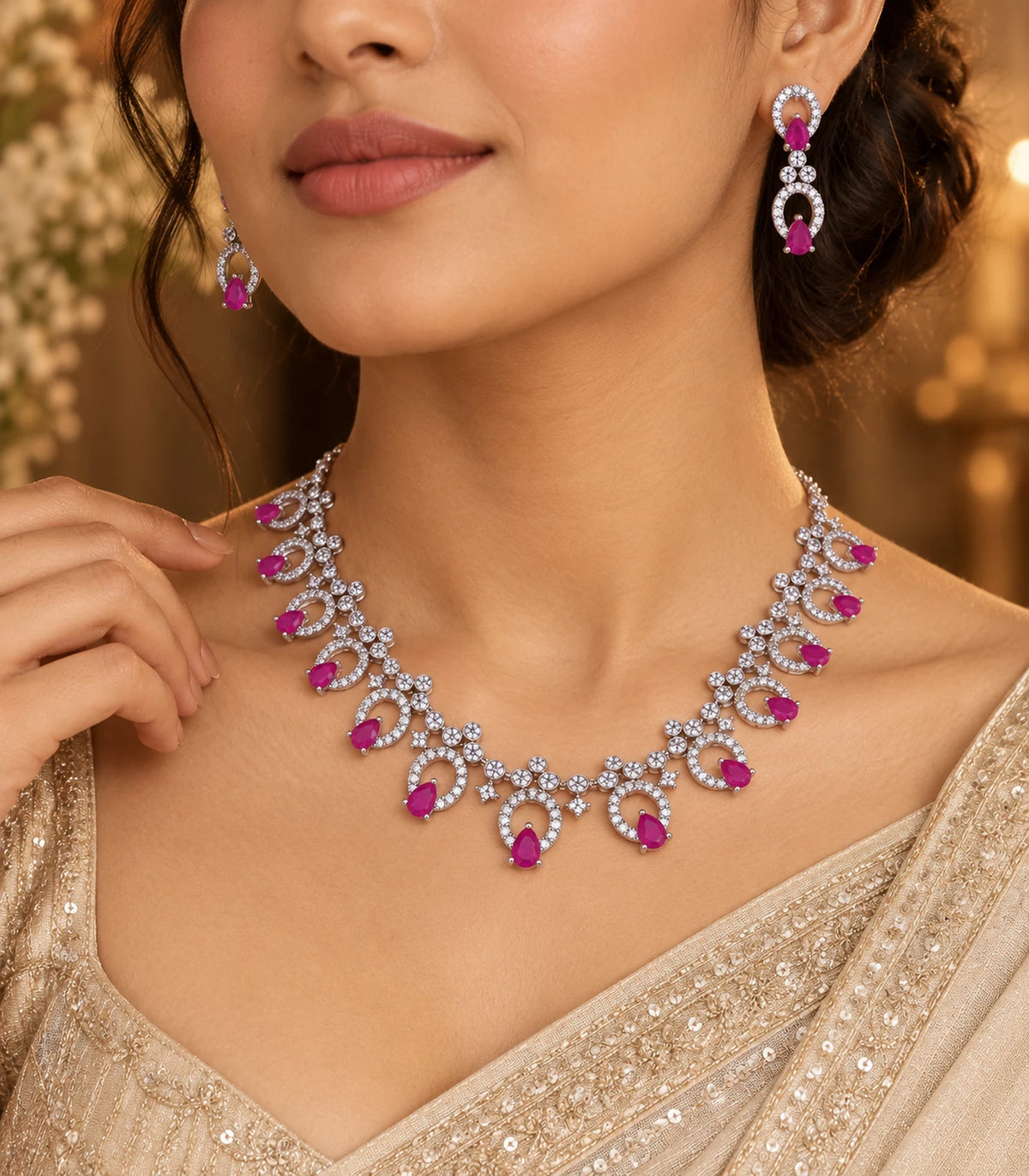 Silver-tone magenta teardrop necklace set and matching earrings styled with a gold outfit