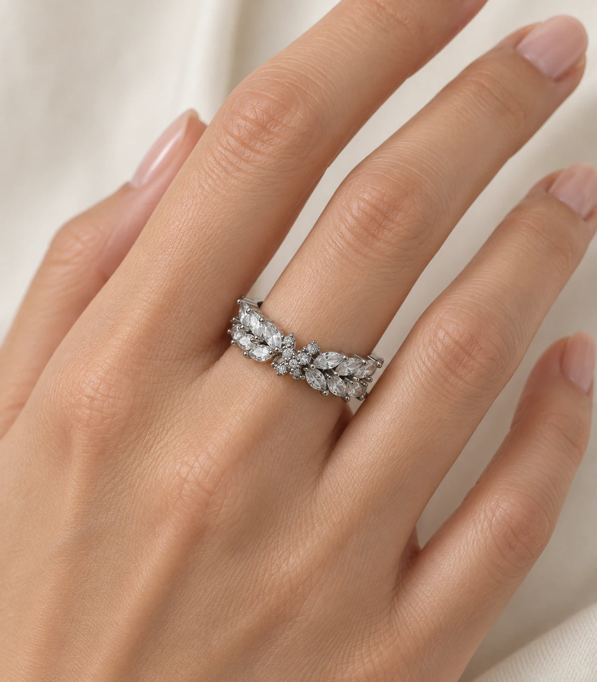 Silver marquise leaf wing open ring worn naturally on a finger