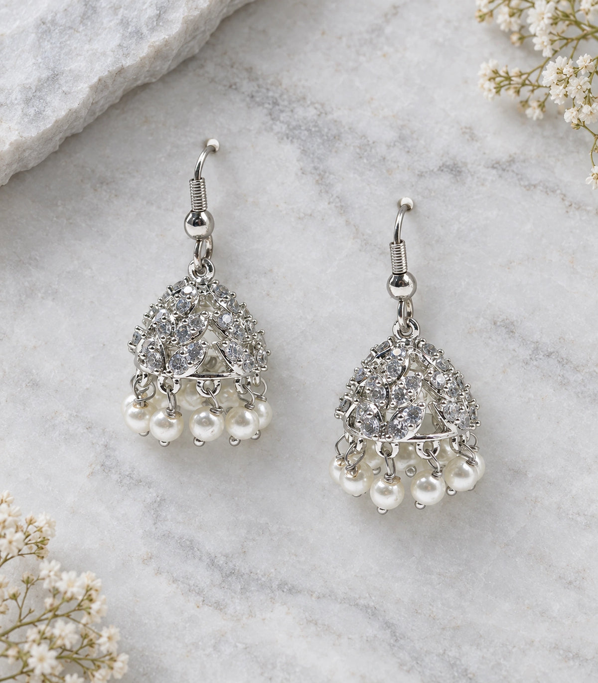 JIMIKI Openwork Crystal Leaf Pearl Hook Jhumka Earrings in Silver - editorial flatlay #color_silver