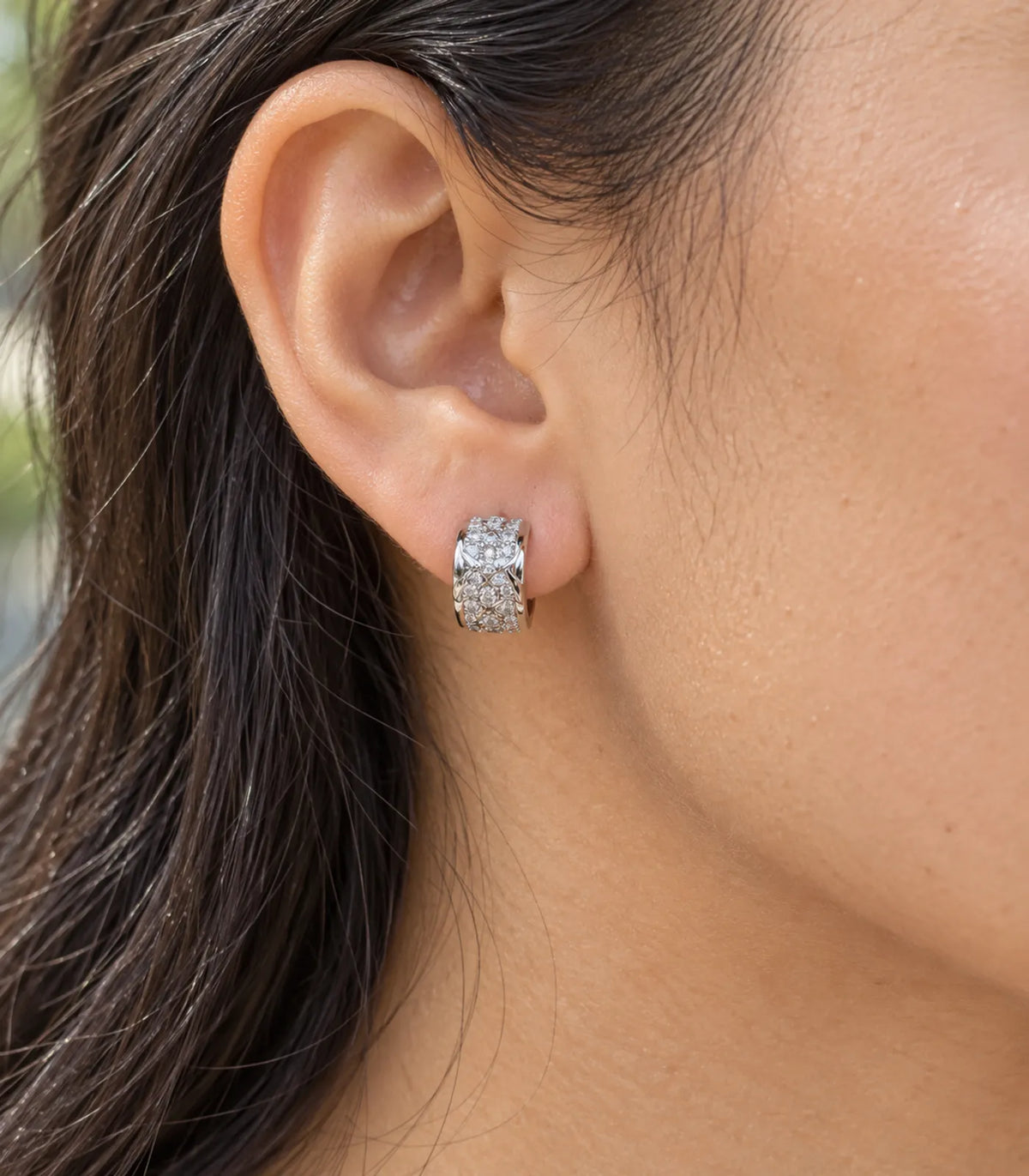 JIMIKI Silver Pave Bow Cross Huggie Earrings — worn close-up detail #color_silver