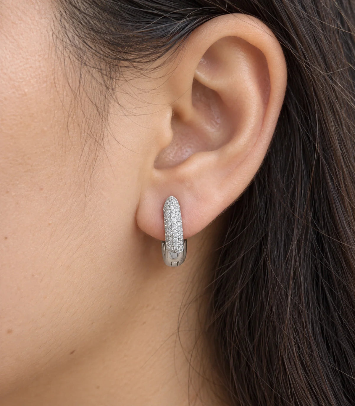 JIMIKI Pave Bar Huggie Hoop Earrings in Silver - worn close-up showing earring detail #color_silver