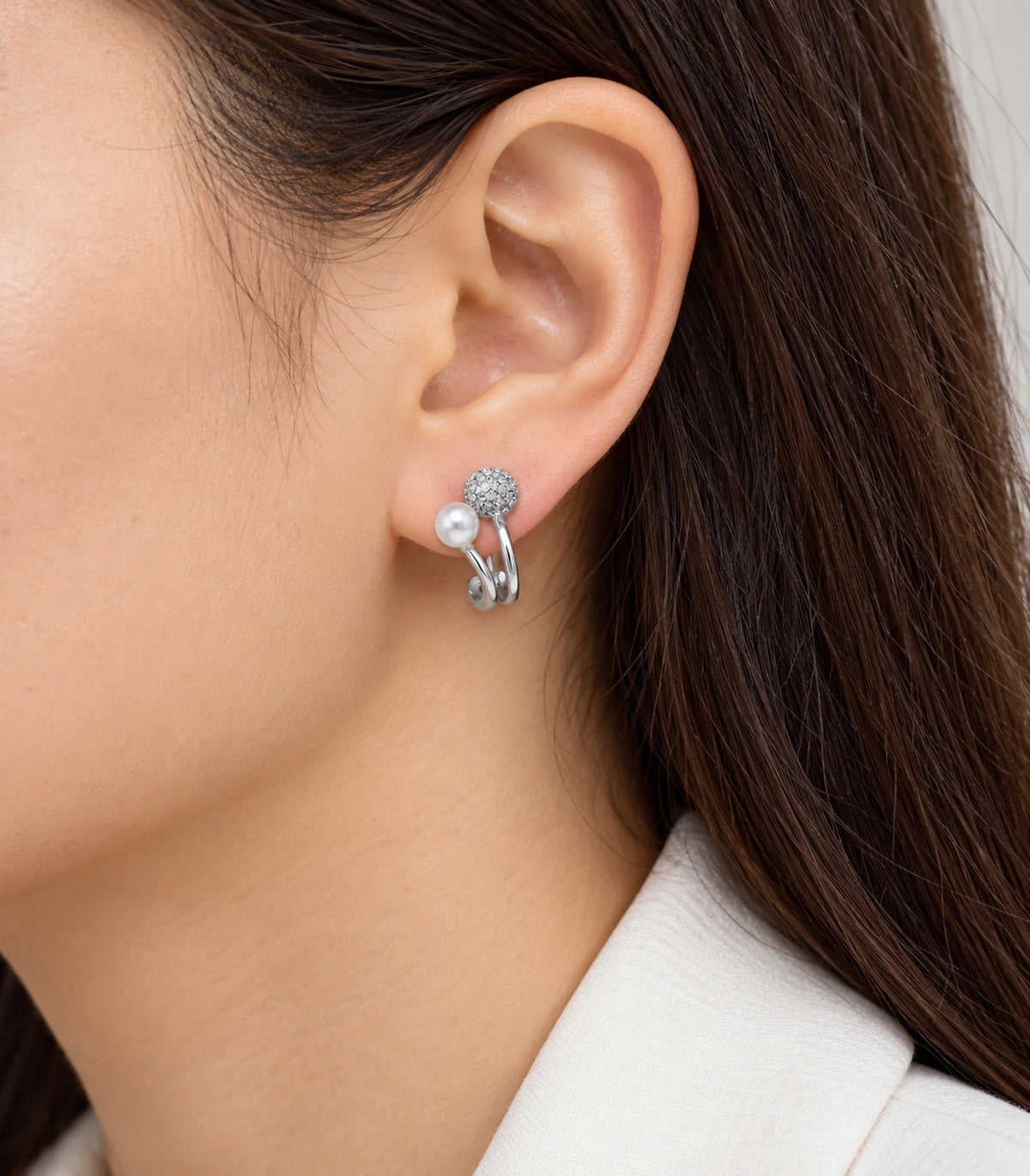 JIMIKI Silver Pearl Pave Disc Sculptural Earrings — worn styling view #color_silver