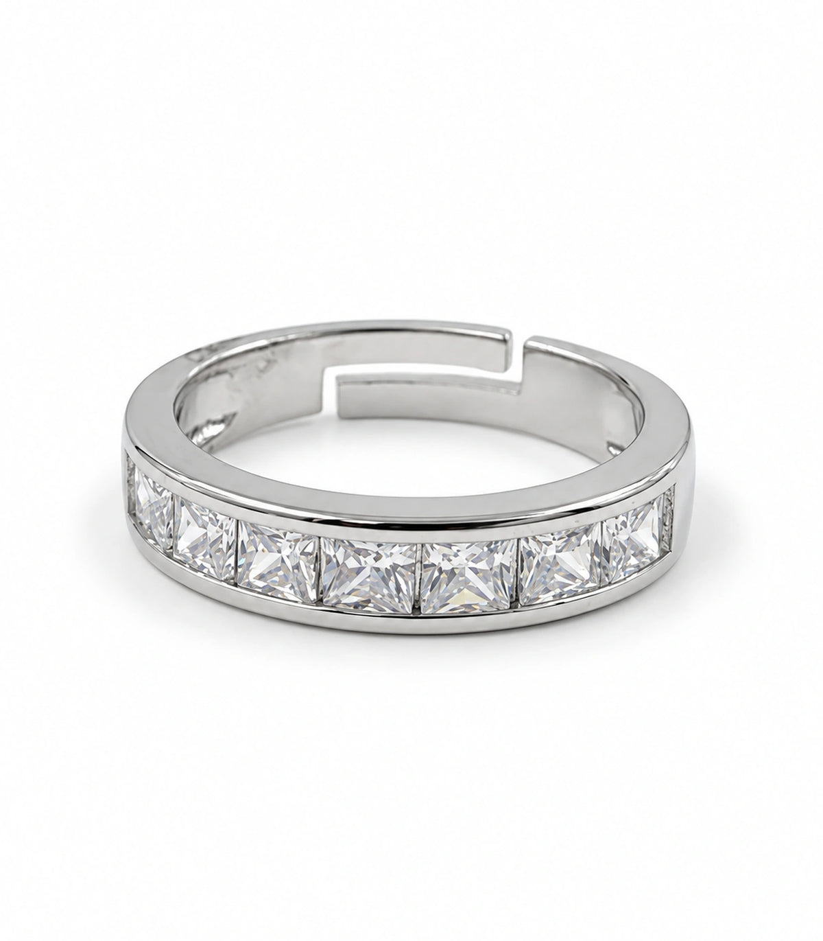 Silver-tone square crystal channel band ring with open stepped shank on white