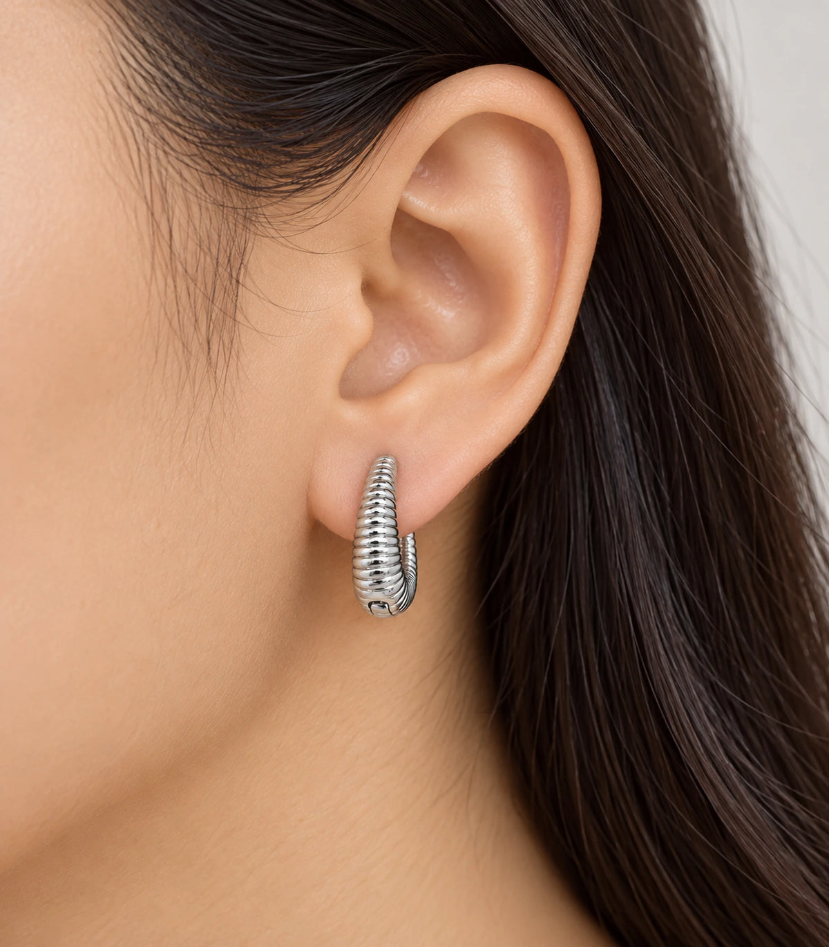 JIMIKI Ribbed Teardrop Hoop Earrings in Silver - model #color_silver