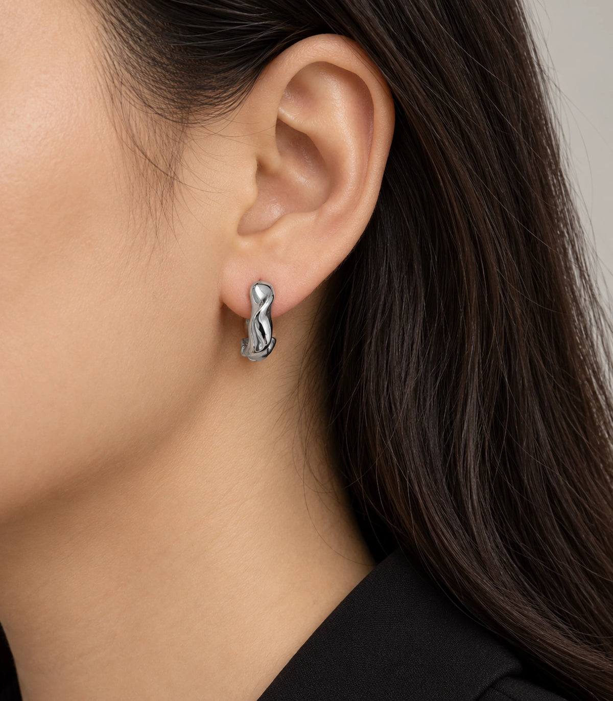 JIMIKI Silver Sculpted Twist Hoop Earrings - model #color_silver