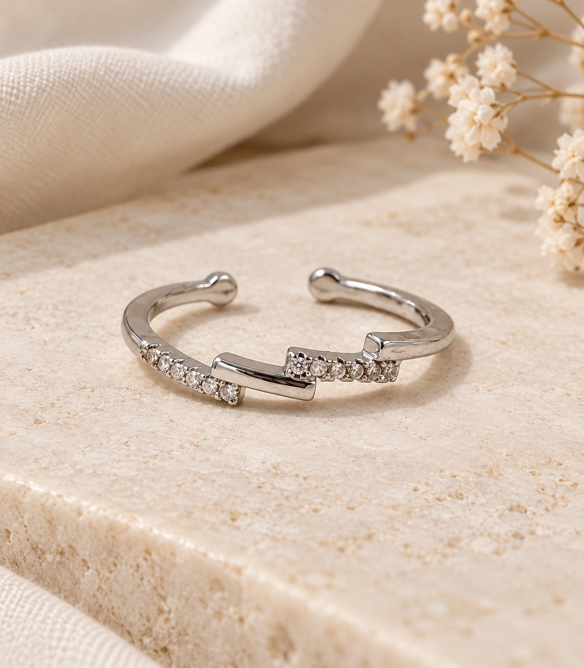 JIMIKI Silver Stepped Crystal Bypass Ring in Silver - editorial flatlay #color_silver
