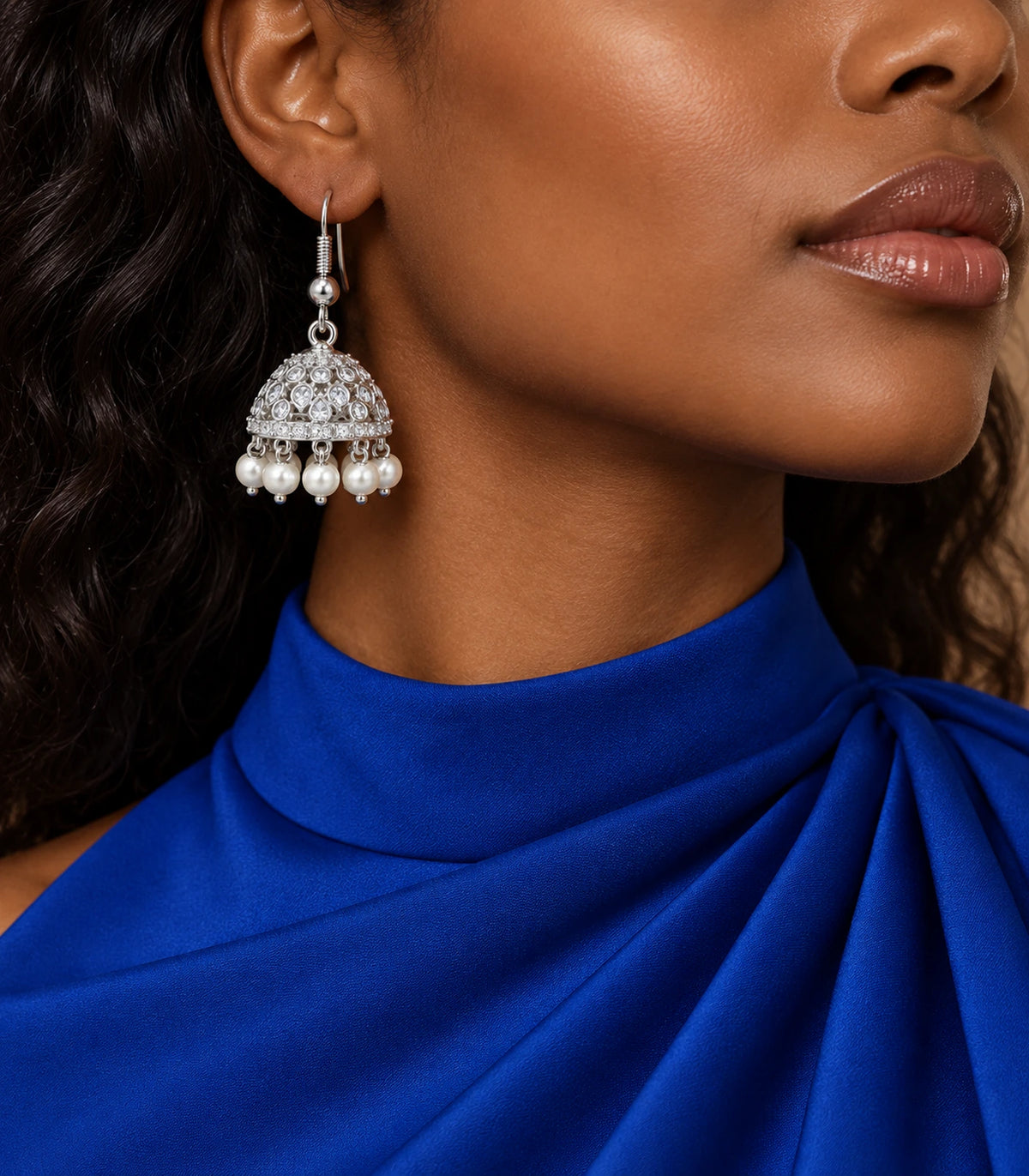JIMIKI Silver Teardrop Crystal Openwork Jhumka Earrings - Earring styled with a blue draped outfit #color_silver