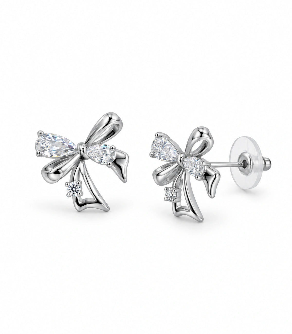 JIMIKI Asymmetric Crystal Bow Stud Earring Pair in Silver / Clear, white background product view #color_silver / clear