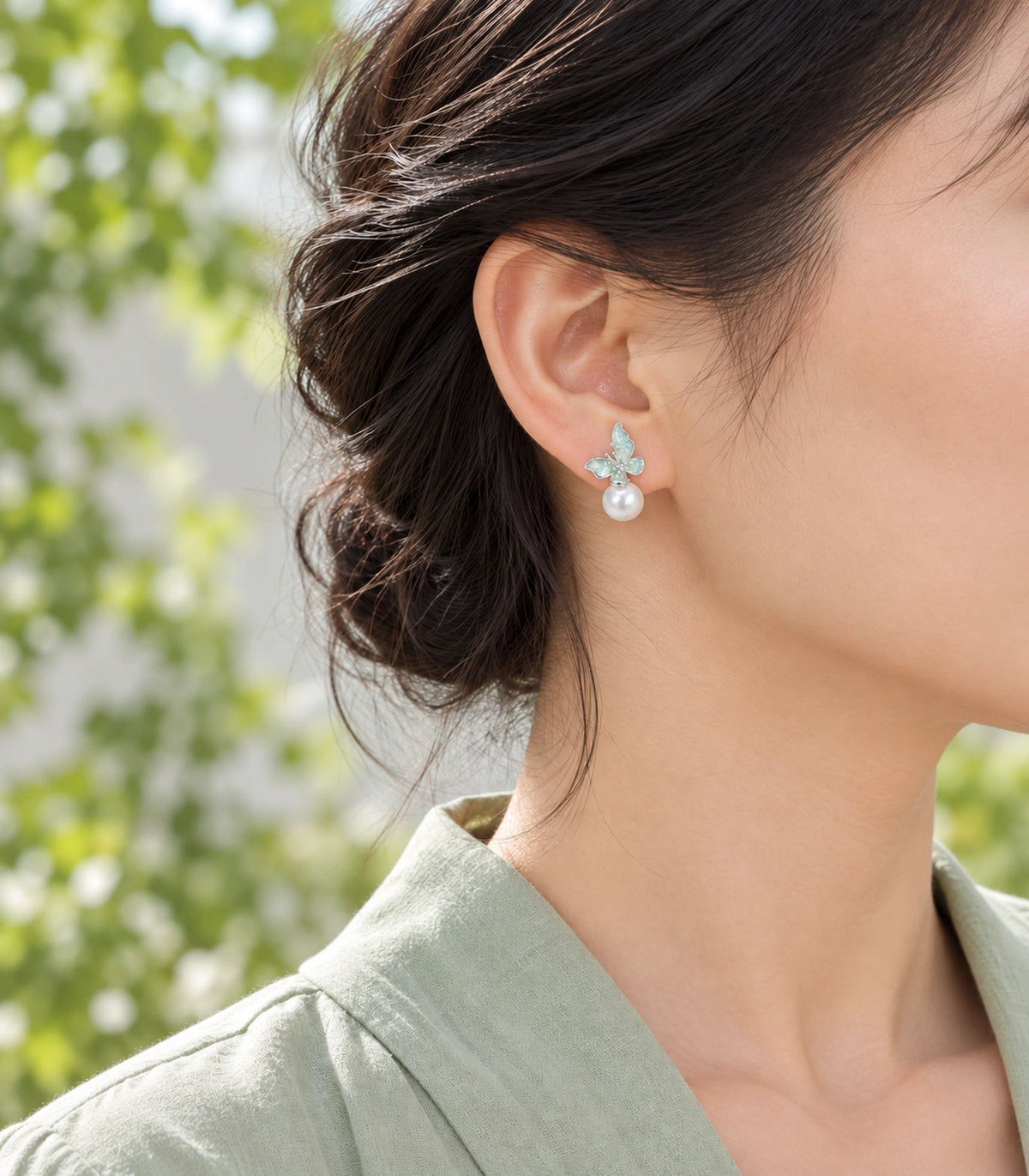 JIMIKI Asymmetric Butterfly Pearl-Style Earrings in Mint / silver-tone / white, model wearing view #color_mint / silver-tone / white
