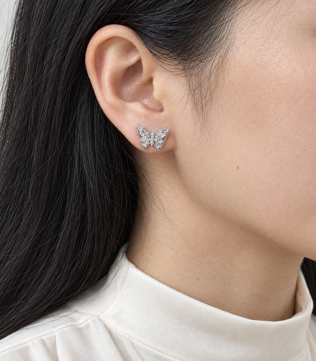 JIMIKI Silver-Tone Baguette Wing Butterfly Stud Earrings in Silver-tone, model wearing view