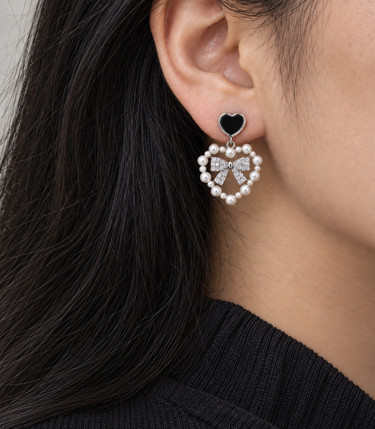 JIMIKI Heart Pearl Bow Drop Earring Pair in Silver Tone / Black, close-up detail #color_silver tone / black