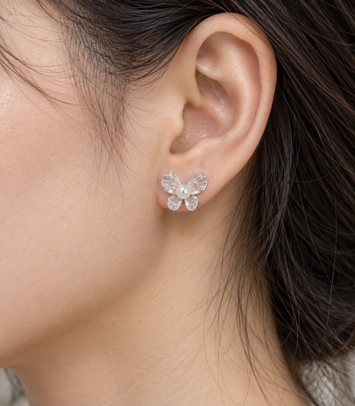 JIMIKI Silver Tone Blush Pink Pearl Butterfly Stud Earring Pair in Blush pink, close-up detail