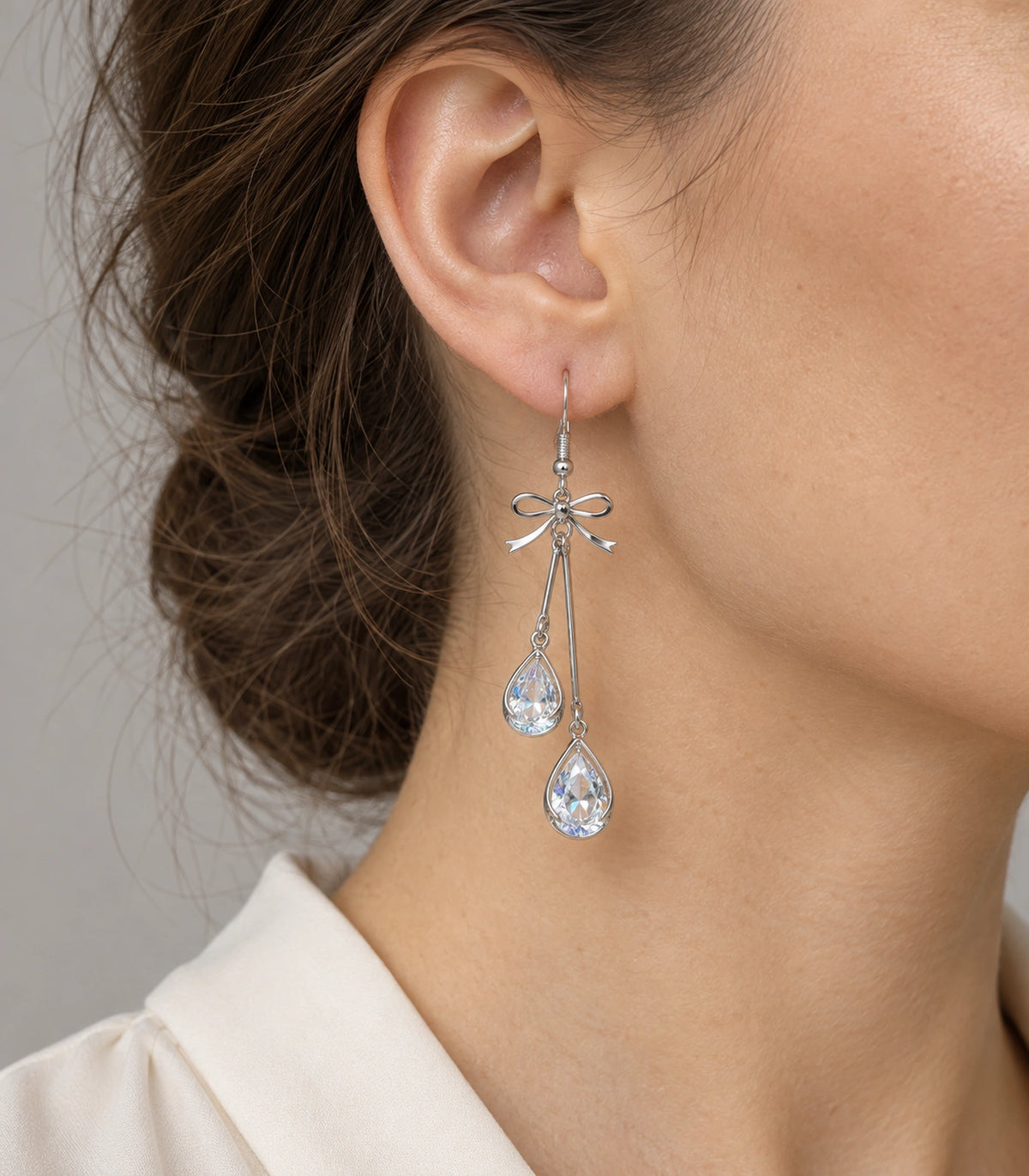 JIMIKI Silver Tone Bow Twin Pear Wire Drop Earring Pair in Silver-tone, model wearing view