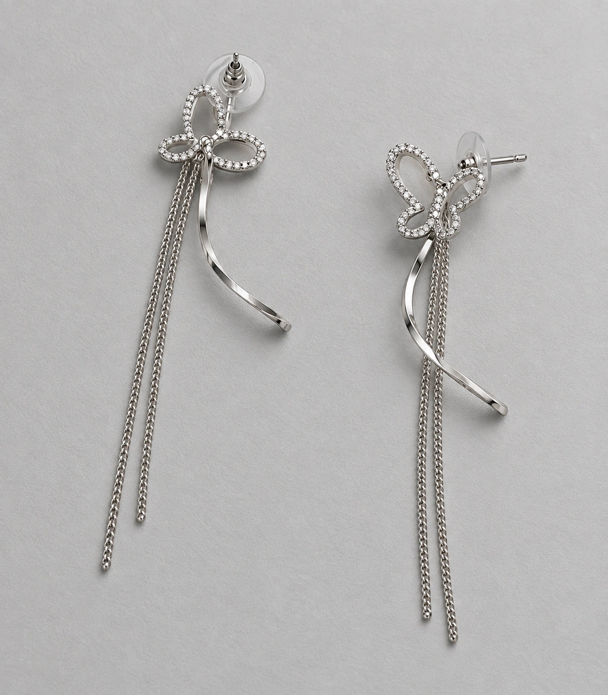 JIMIKI Butterfly Ribbon Chain Drop Earrings in Silver-tone, editorial flat lay #color_silver-tone
