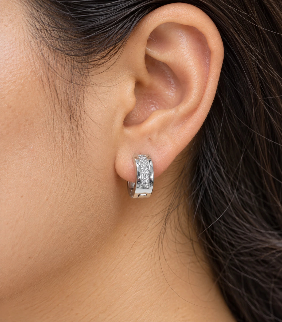 JIMIKI Silver central pave strip huggie hoop earrings, worn closeup of clear central pave strip #color_silver