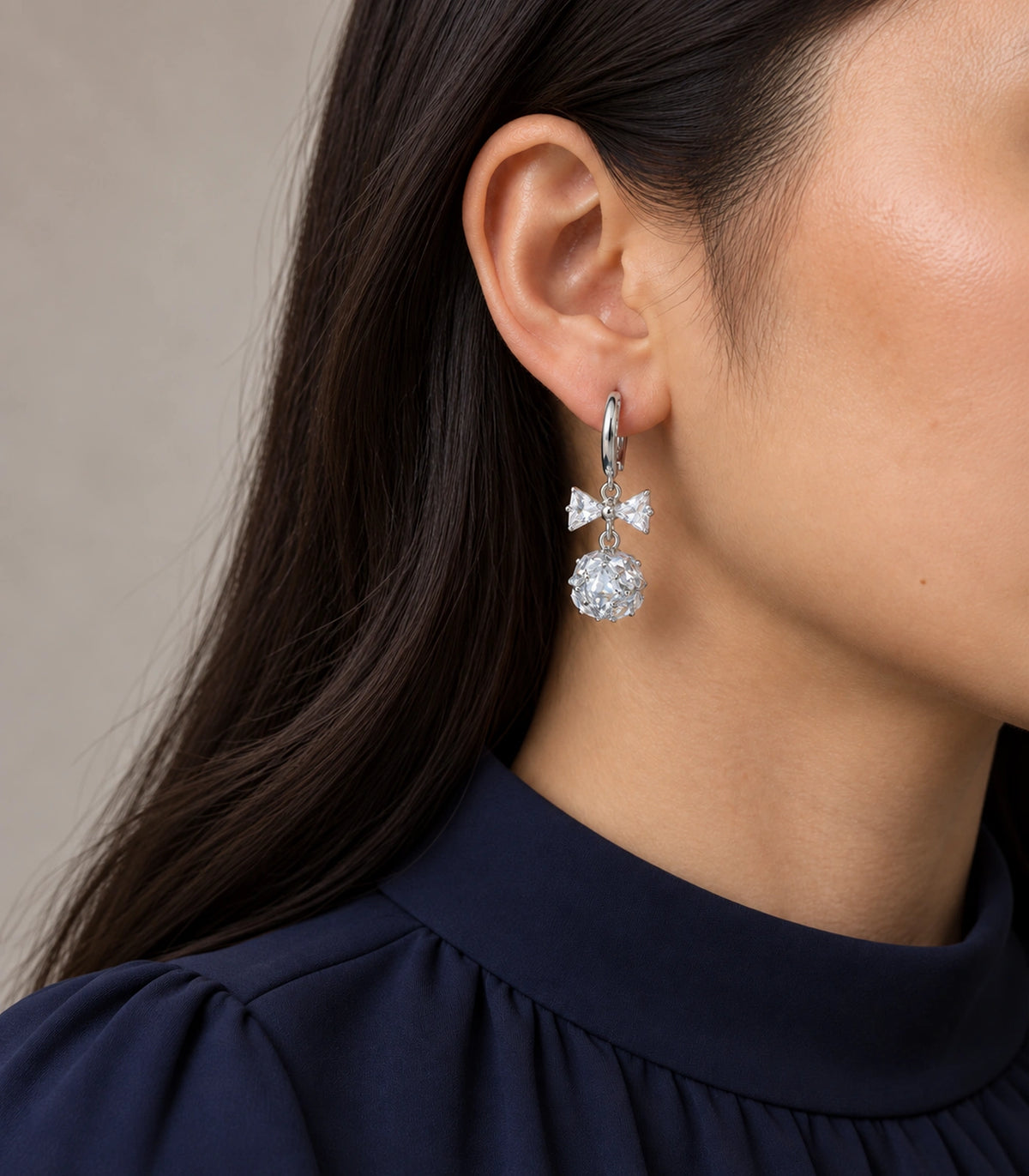 JIMIKI Silver Tone Clear Crystal Bow Cluster Ball Hoop Earring Pair in Silver tone / clear, model wearing view