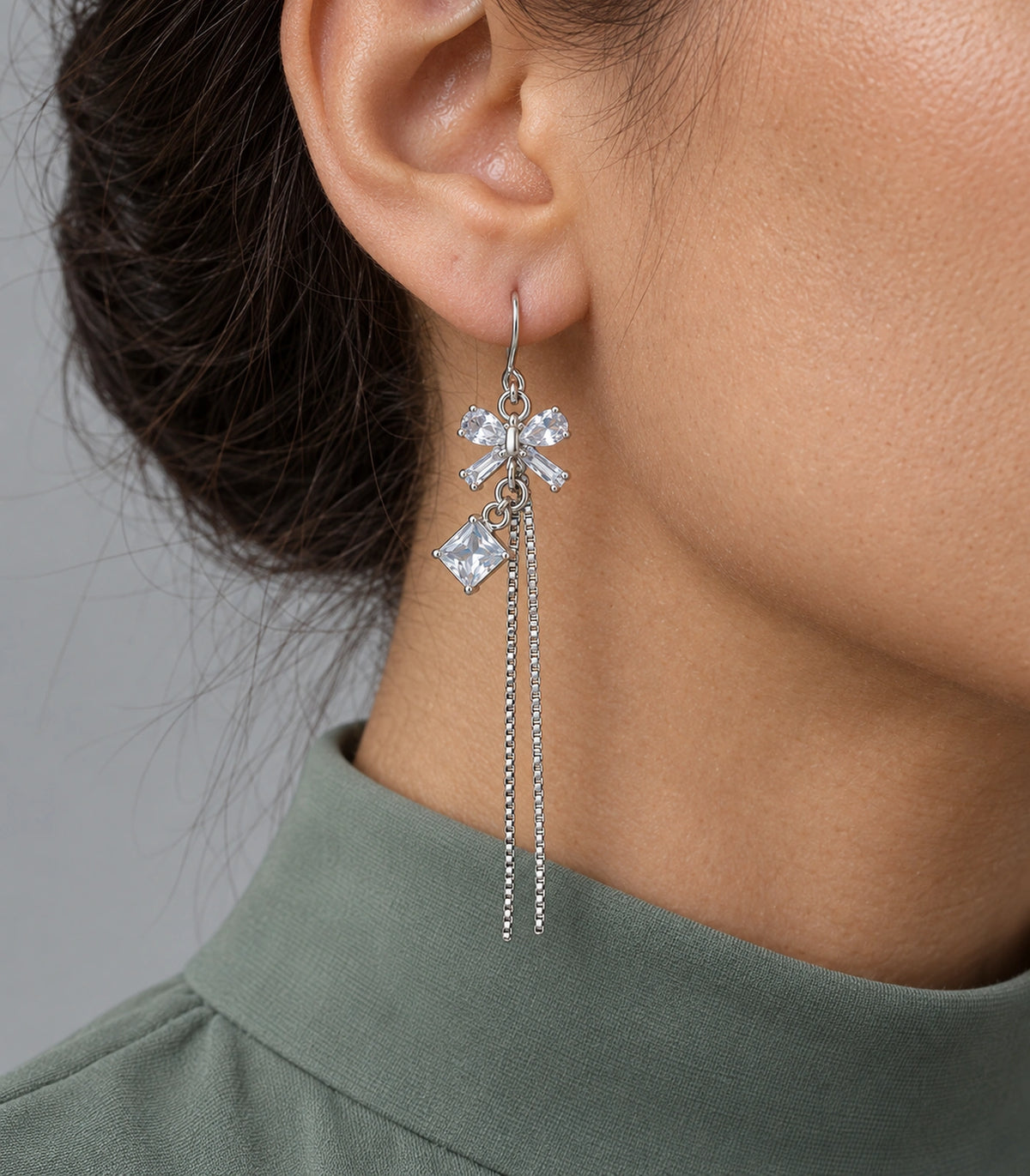 JIMIKI Silver Tone Clear Crystal Bow Square Chain Tassel Earring Pair in Silver tone / clear, close-up detail