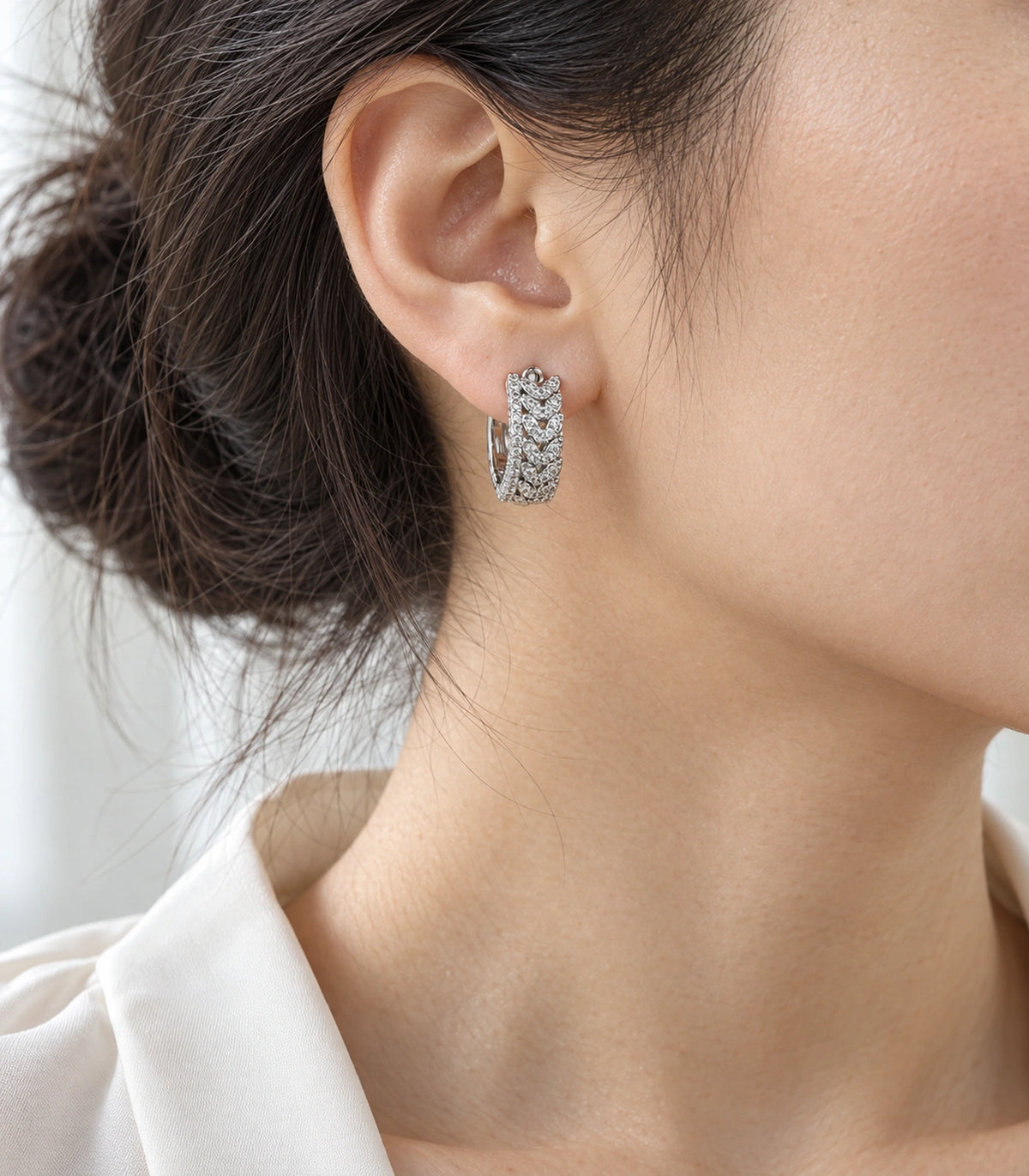 JIMIKI Crystal Chain Pattern Hoop Earring Pair in Silver tone/Clear, editorial model view #color_silver tone/clear
