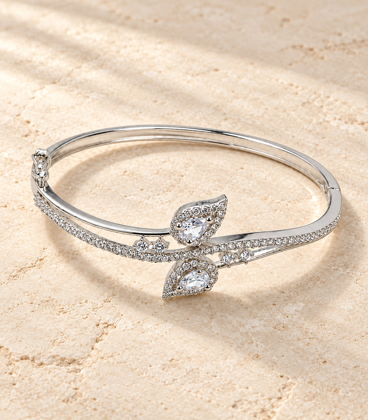Silver-tone clear double leaf bangle editorial flatlay