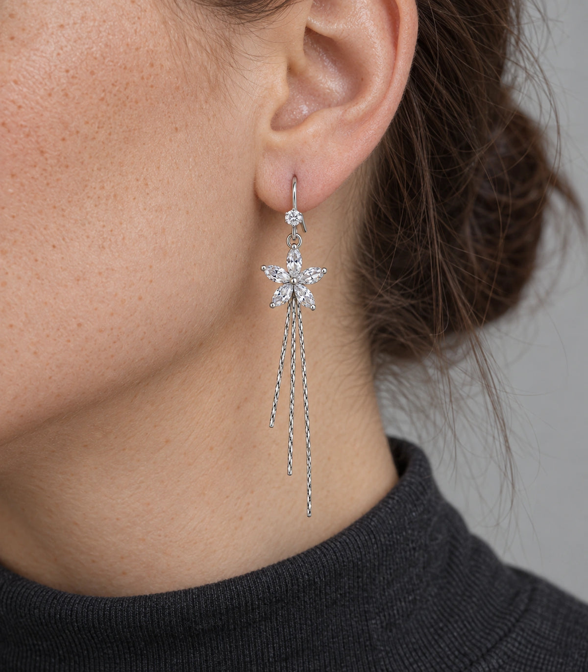JIMIKI Silver Tone Clear Five Petal Flower Chain Tassel Earring Pair in Silver tone / clear, close-up detail
